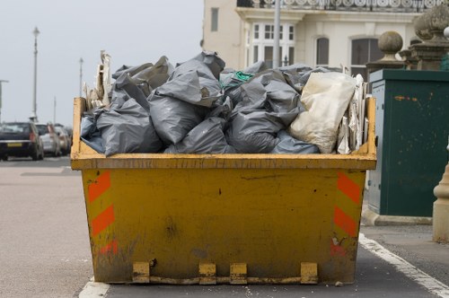 Workers managing builders waste clearance in Greenwich