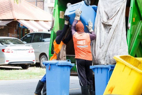 Collection team preparing to enter a terraced house with bulky items